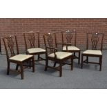 A set of five Chippendale style mahogany dining chairs, including one carver, drop in seats,