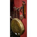 A brass Burmese gong with wall bracket and beater 30cm diameter