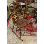 An elm and ash Windsor rocking chair, hooped back, pierced splat, turned supports,