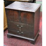 George III mahogany commode in the form of a tallboy of small proportions.