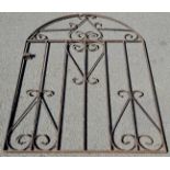 An arch topped wrought iron gate