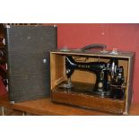 A cased Singer 99K sewing machine,