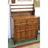 An oak dresser, single bar back plate rack to top,