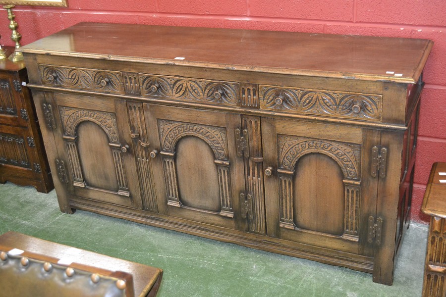 An oak sideboard in the monastic taste, moulded top,