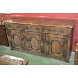 An oak sideboard in the monastic taste, moulded top,