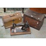 A Jones hand operated sewing machine, late 19th century, shaped base, cased; another, Singer (2).