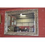 A contemporary silver gilt framed wall mirror. 75cm x 104cm.