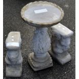 Garden ornaments - a pair of reconstituted stone squirrel shaped plinths; a bird bath, round top,