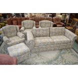 A large two seater sofa, three armchairs and pouffe,