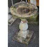 Garden ornaments - a reconstituted stone pedestal birdbath, dished circular top, baluster column,