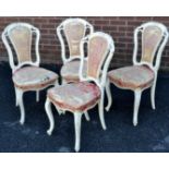 A set of four Louis XV style salon chairs, leafy shaped backs, padded backs, stuffed-over seats,