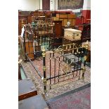 A Victorian brass and metal bed with mother of pearl inlay