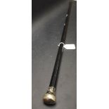 A silver topped walking cane,