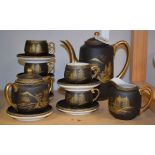 Ceramics - a Japanese eggshell porcelain black and gilt coffee service,