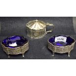 A 20th century three piece condiment set, comprising a pair of open salts and mustard pot,