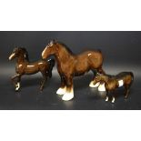 A Royal Doulton Shire horse brown gloss; a brown gloss mare left leg raised;