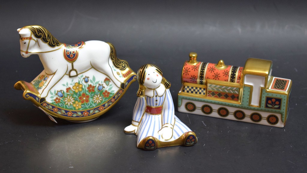 A Royal Crown Derby Treasures of Childhood miniature Ragdoll; others, Steam Train and Rocking Horse,