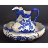 A reproduction blue and white floral washing jug and bowl