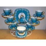 A Windsor tea service for six decorated with ripe fruits and vine leaves on a turquoise ground,