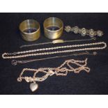 Silver - A pair of Victorian napkin rings; rope necklaces; a heart shaped pendant on chain; another;