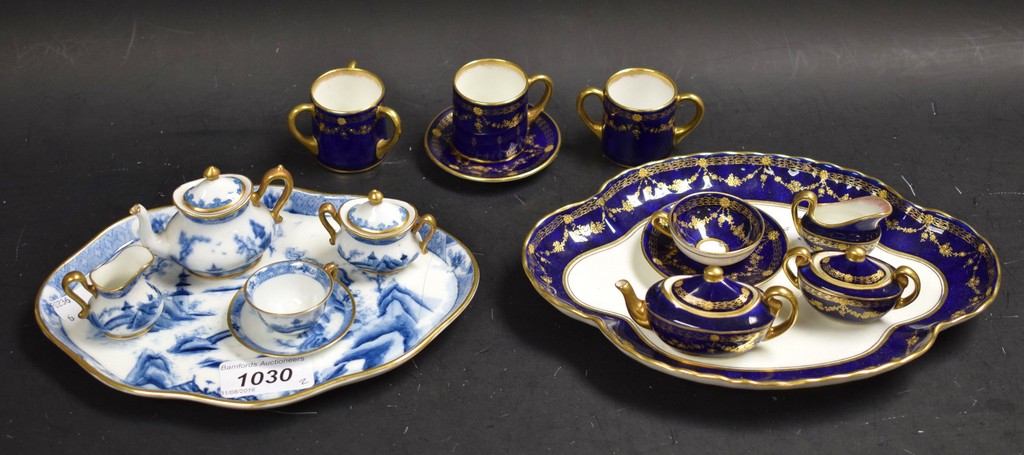 A Royal Doulton 10 piece cabaret set decorated with gilt swags on a blue ground,