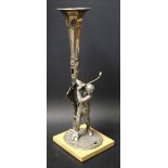 An Edwardian golfing vase, cast as a golfer taking a swing,