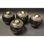 A set of four vintage Penhurst Taylor & Rolph Bias 3 bowls, black lacquered bodies, No 1, 2,