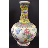 A Chinese Famille Verte baluster vase, decorated in colourful polychrome,