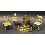 Brass Miniatures - A balloon backed chair; a tilt top tripod table; a helmet shaped coal scuttle;