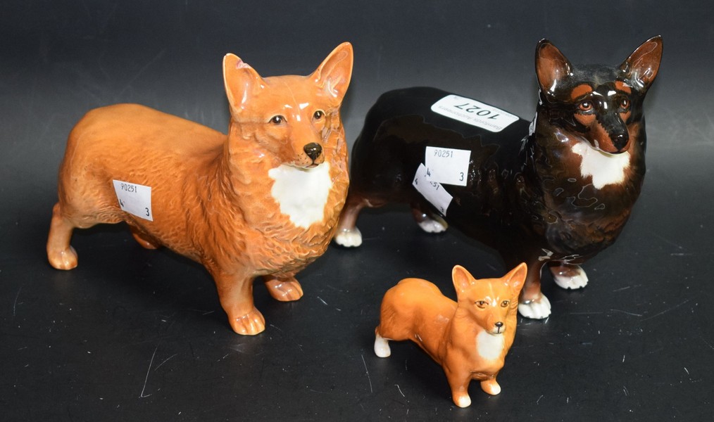 A Beswick black and white Corgi dog; another tan and white;