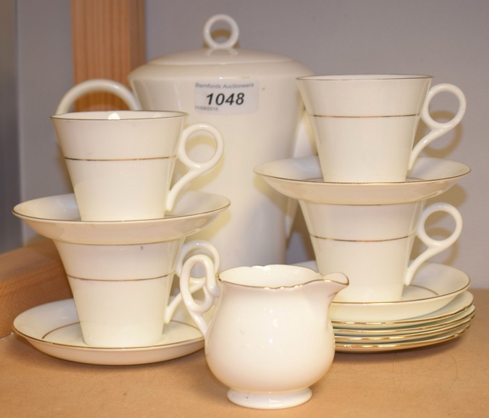 A composed Shelley four-setting coffee service, comprising coffee pot, milk jug, coffee cups,