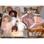 Dolls - a wooden rocking cradle with porcelain headed doll; others,