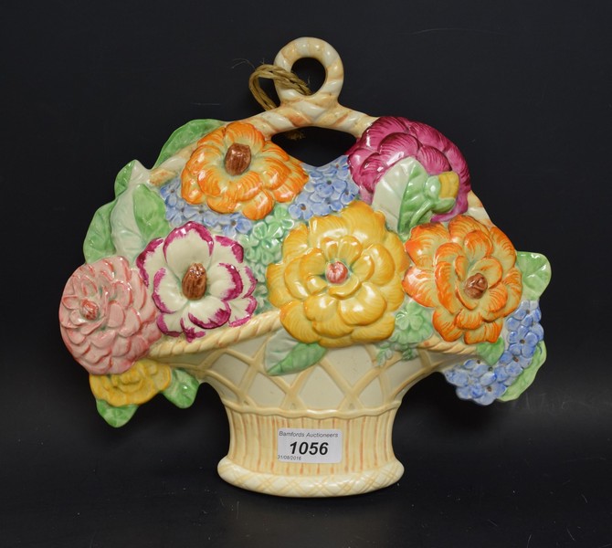 A Beswick wall plaque, in the form of a basket of colourful flowers, 28cm high, printed marks,