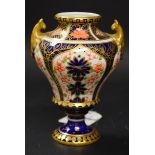 A Royal Crown Derby 1051 pattern ovoid vase, twin gilt handles, printed and painted marks,