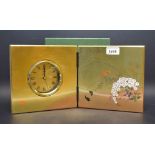 A Japanese lacquered folding quartz clock, folding front,