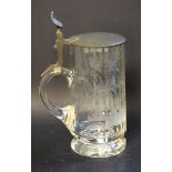 A late 19th century glass tankard, the faceted sides etched with a stag in woodland, pewter lid, c.