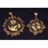 Two gilt and engraved Indian pendants