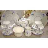 A Victoria floral tea service for six comprising teapot, side plates, bread and butter plates,