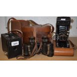 A pair of Bausch & Lomb military binoculars in leather case; a Soho Myna folding camera,