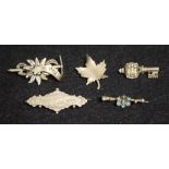 Five Victorian and later silver brooches