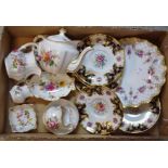 A set of five Royal Crown Derby saucers, printed with colourful summer flowers,