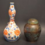 A Japanese double gourd vase, decorated with Imari pallet flowers, 18.