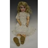 An Armand & Marseille bisque head and partially fixed ball jointed bodied doll,