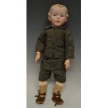 A Heubach bisque porcelain head boy doll, moulded and painted hair, fixed blue eyes, closed mouth,
