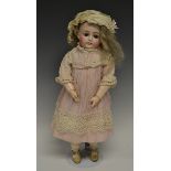 A Kestner bisque porcelain child doll, fixed brown eyes, closed mouth, painted eye lashes,