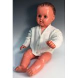A late 1950s Pedigree Boo doll, retractable blue eyes, moulded brown hair, vinyl body,