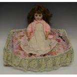 A Simon & Halbig for Louis Lindner & Sohne bisque head girl doll with brown glass sleeping eyes,