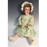 An Armand & Marseille bisque head doll, sleeping brown glass eyes,