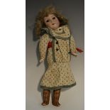 An Armand Marseille bisque head doll, weighted brown eyes, open mouth with teeth, light brown hair,