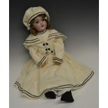 An Armand & Marseille bisque head doll, sleeping blue glass eyes,